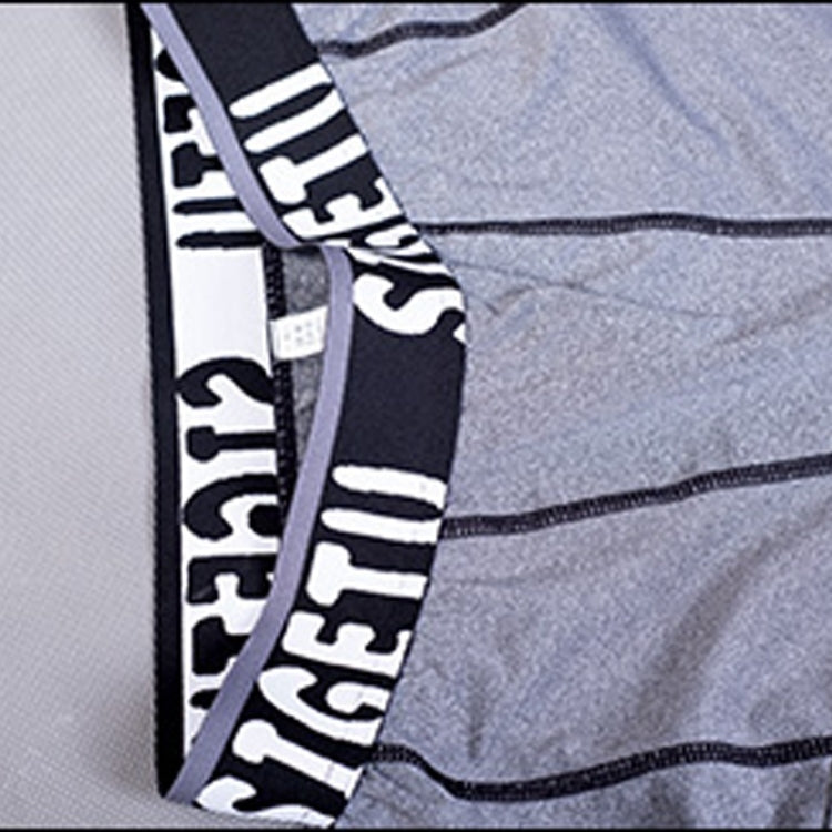 Logo waistband detail on light gray compression tights with contrast stitching