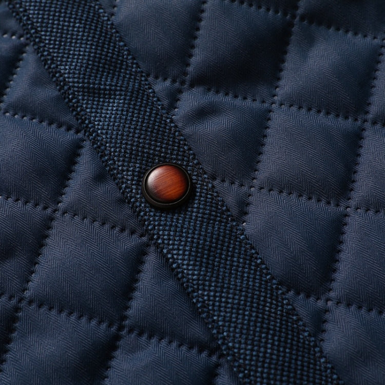 Quilted navy jacket fabric with textured stitching and small round button
