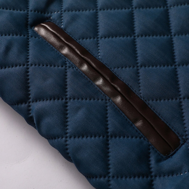 Navy quilted jacket with brown leather-look trim on a diagonal pocket