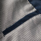 Striped lining with navy edge trim along a seam