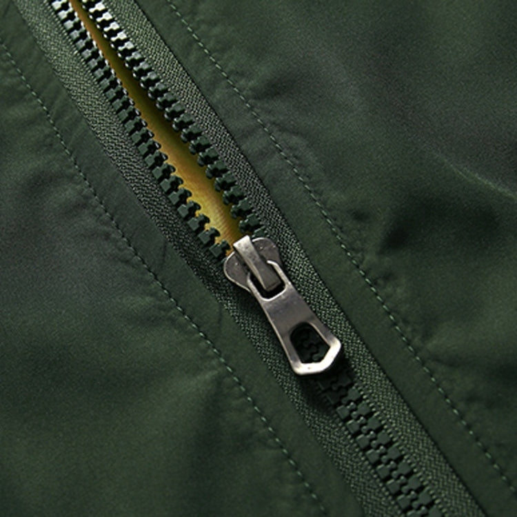Dark green jacket close-up of metal zipper and stitched seam detail.