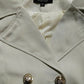 Light beige trench jacket fabric detail with V-neck facing and embroidered trim