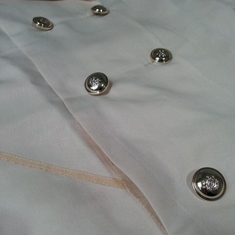Light beige trench jacket close-up with round metallic buttons