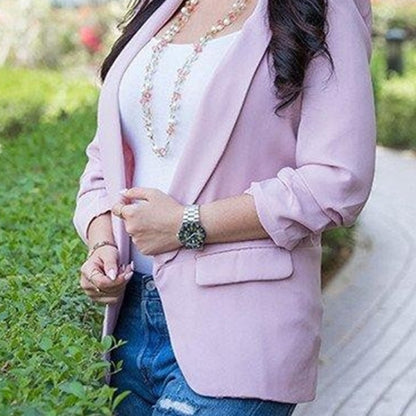 Women’s light pink blazer jacket with single-breasted lapels and long sleeves