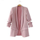 Women’s light pink blazer jacket on hanger, open front with flap pockets