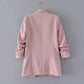 Women’s light pink blazer jacket back view with center seam and long sleeves
