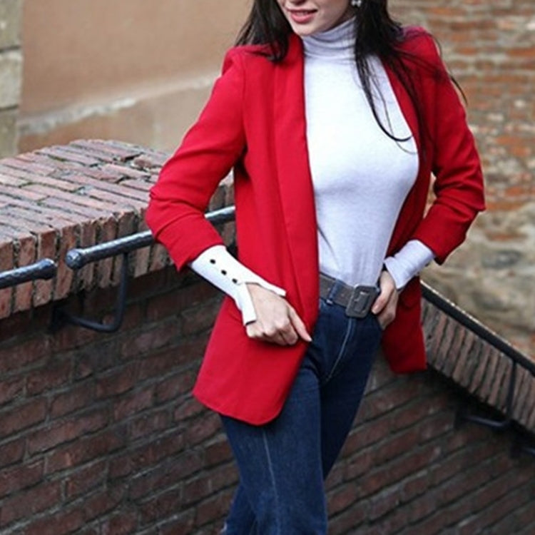 Red open-front blazer with lapels, long sleeves, styled with a waist belt