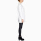 White long-sleeve blazer, side profile view, with cuffed sleeves and long hem.