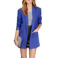 Blue long-sleeve blazer with flap pockets and center front opening over gray top and black bottoms