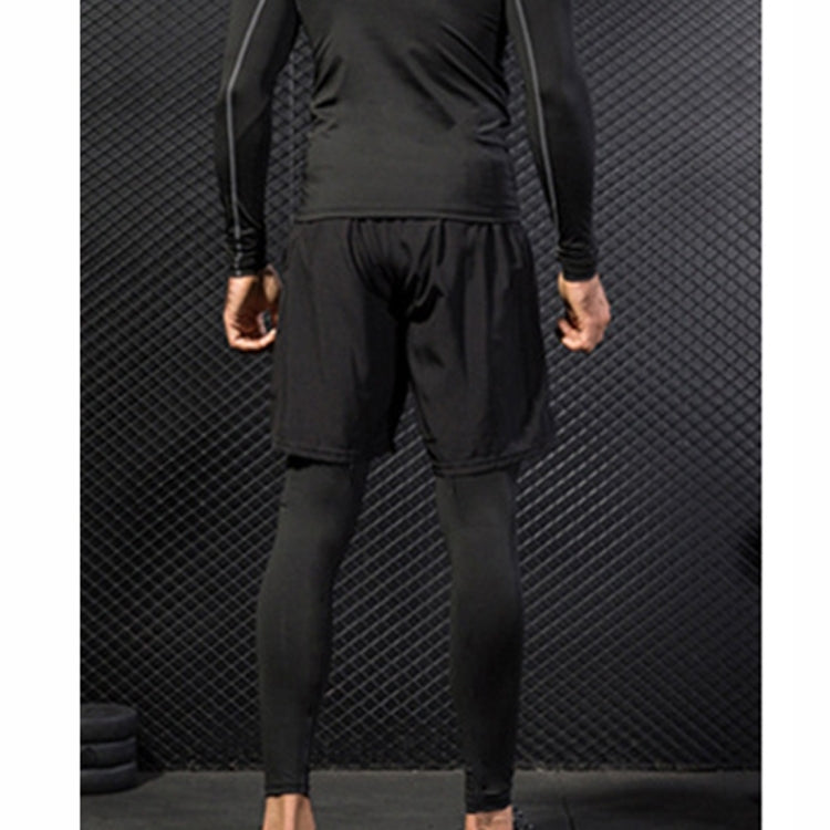 Black two-layer workout pants: loose shorts over fitted legging sleeves.
