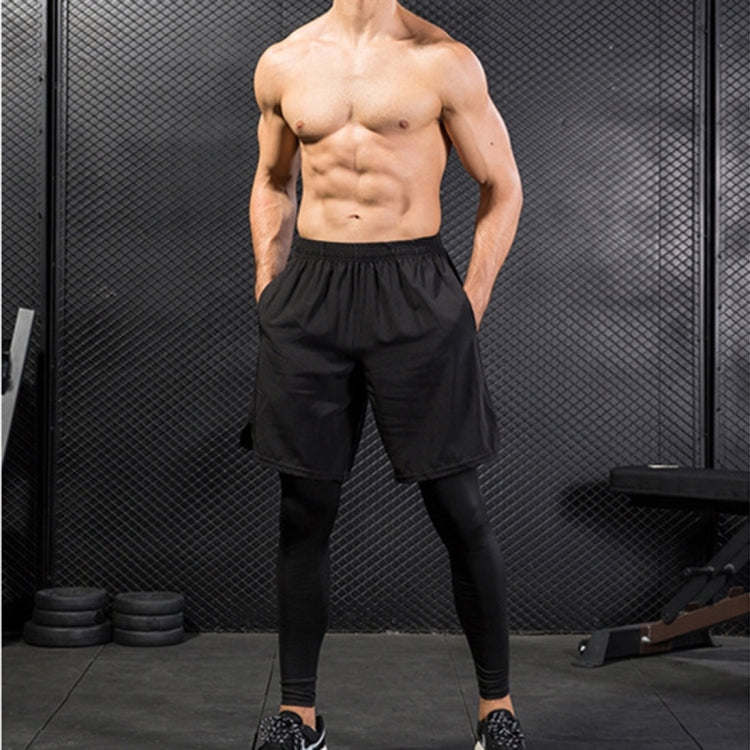 Black workout pants set with baggy shorts overlaying fitted compression leggings.