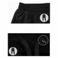 Black two-piece pants detail: elastic waistband with shorts overlay and drawstring cord.
