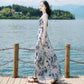 Blue abstract print sleeveless maxi dress, slim fit bodice and flowing skirt