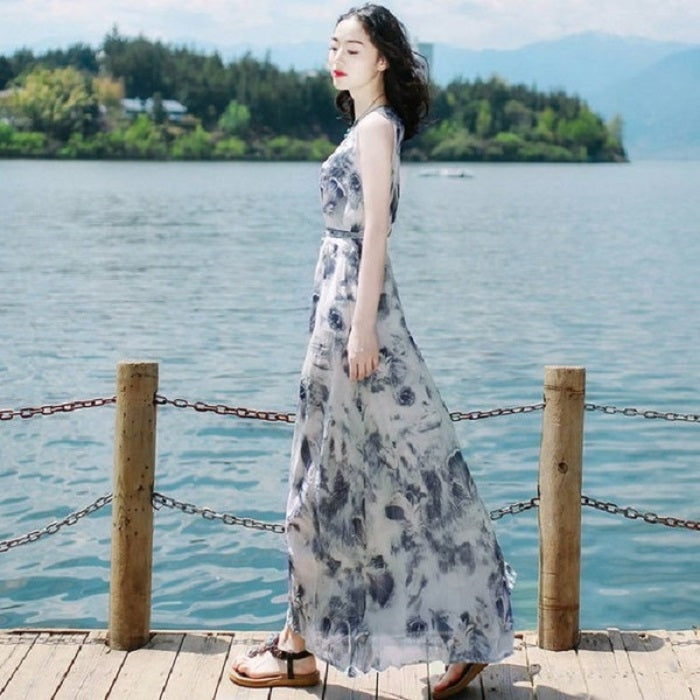 Blue abstract print sleeveless maxi dress, slim fit bodice and flowing skirt