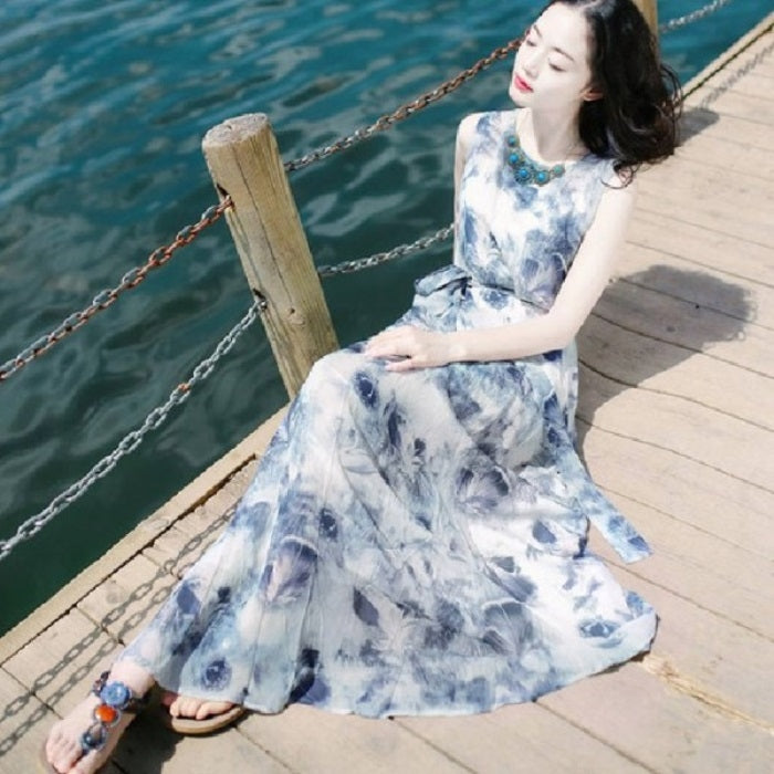 Blue-and-white tie-dye style sleeveless maxi dress with gathered skirt and sleeveless cut