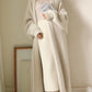Ivory knit cardigan sweater coat with ribbed hem and open front