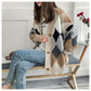 Open-front long knit cardigan in cream and khaki with navy diamond motifs and wooden buttons