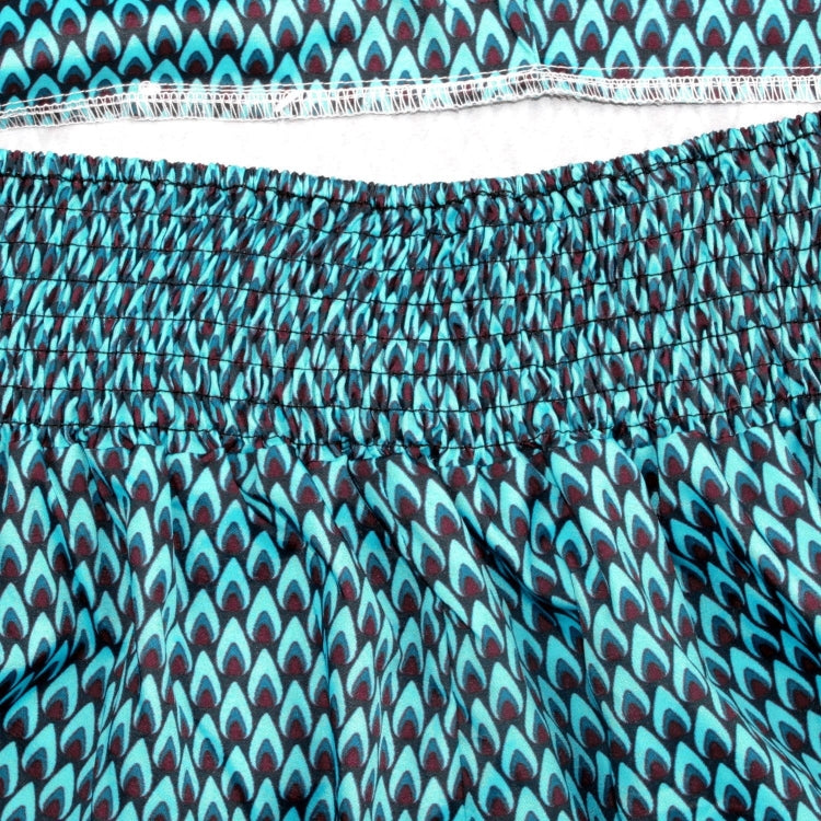 Close-up of teal-and-navy patterned fabric with elastic waistband