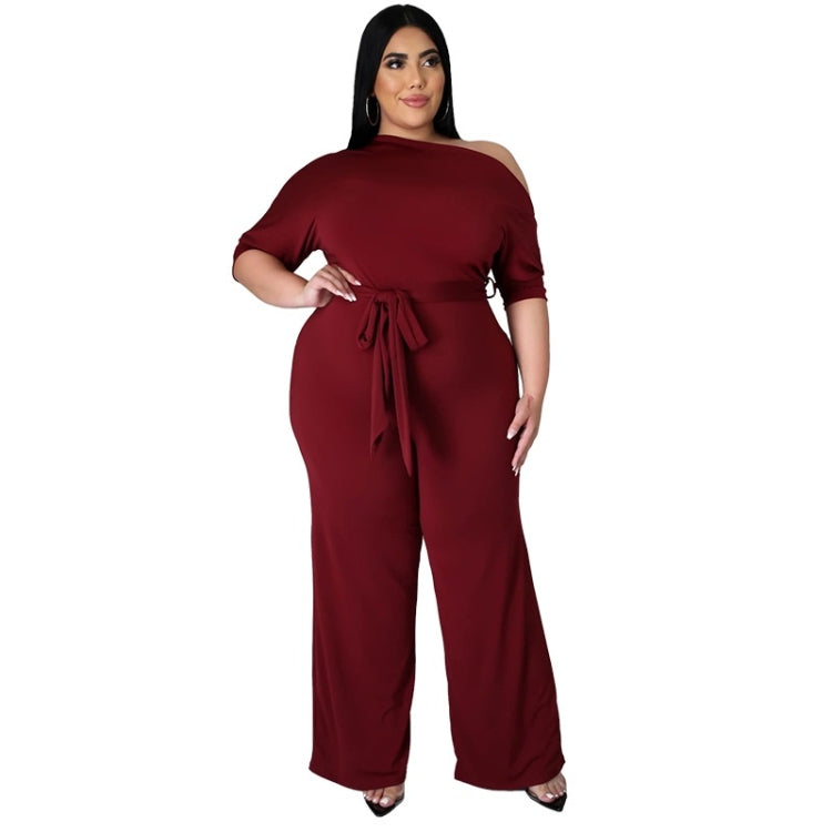 Wine red asymmetrical off-shoulder jumpsuit with tie waist and wide-leg pants